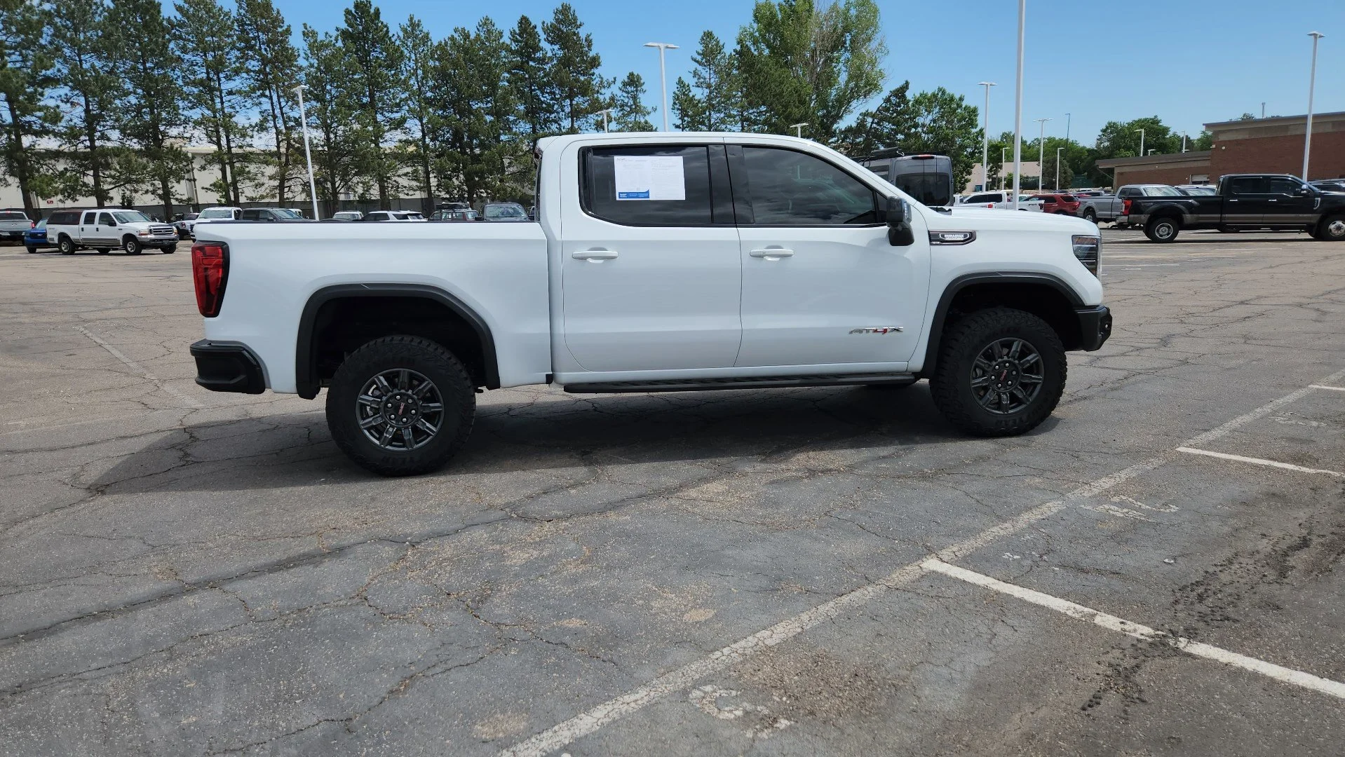 Used 2025 Summit White GMC AT4X image 11