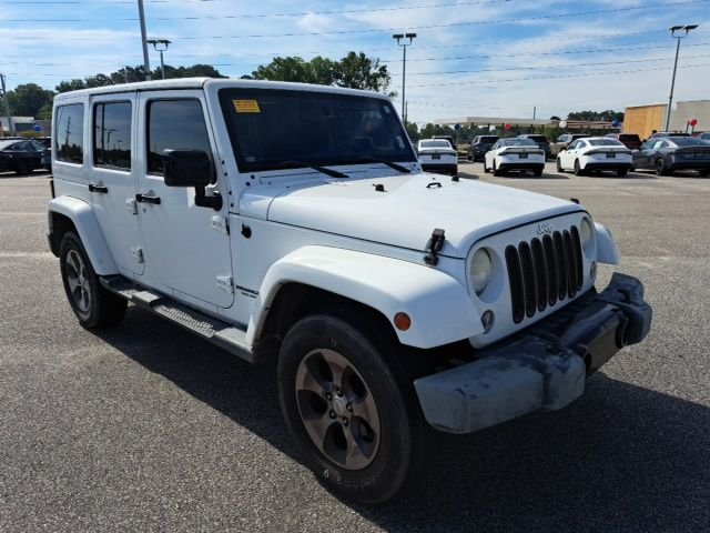 Used 2014 White Jeep Unlimited Altitude image 1