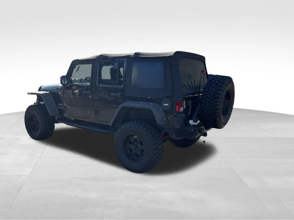 Used 2013 Brown Jeep Unlimited Sport image 4