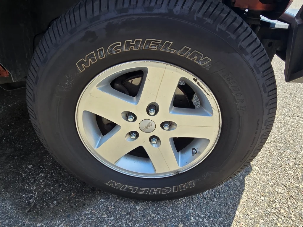 Used 2011 Mango Tango Pearlcoat Jeep Sport image 9