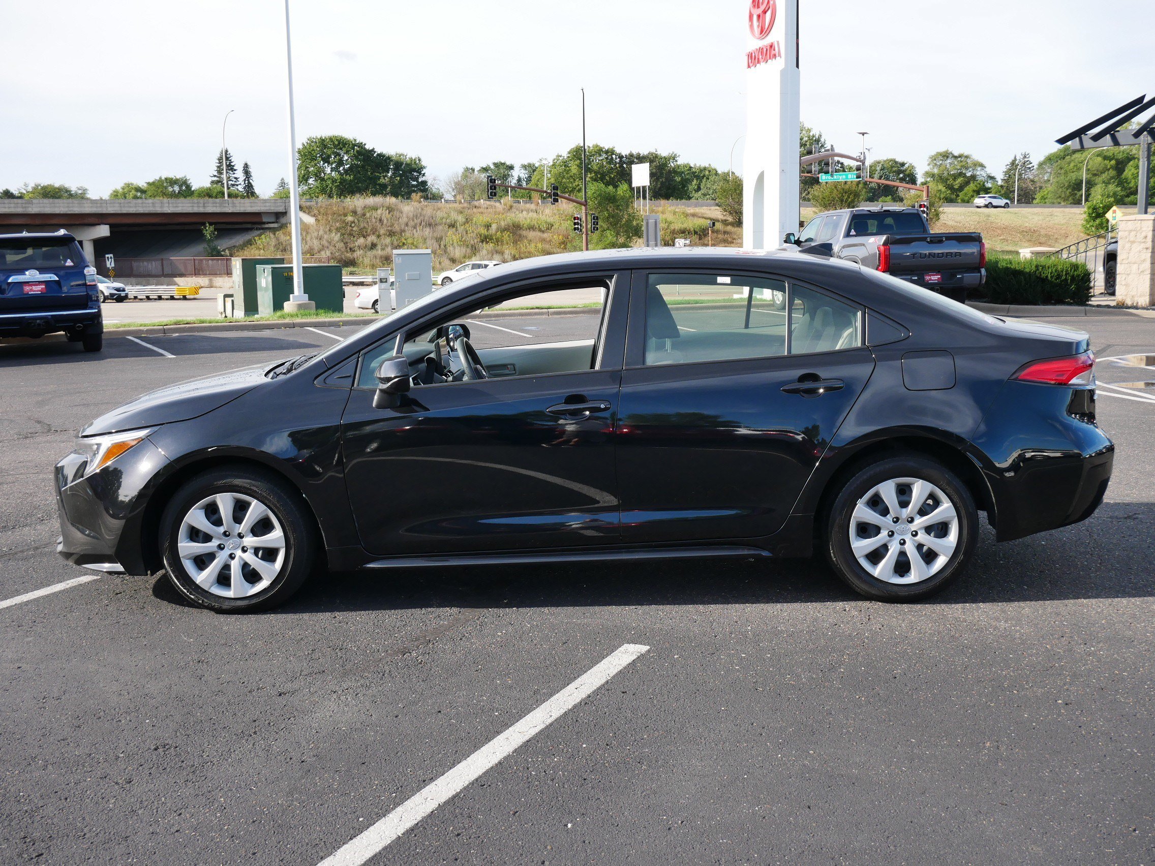 Used 2025 Midnight Black Metallic Toyota Hybrid LE image 4
