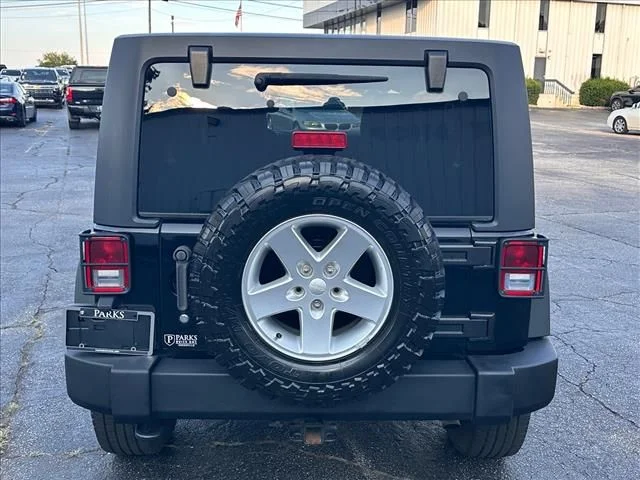 Used 2014 Black Jeep Unlimited Sport image 10