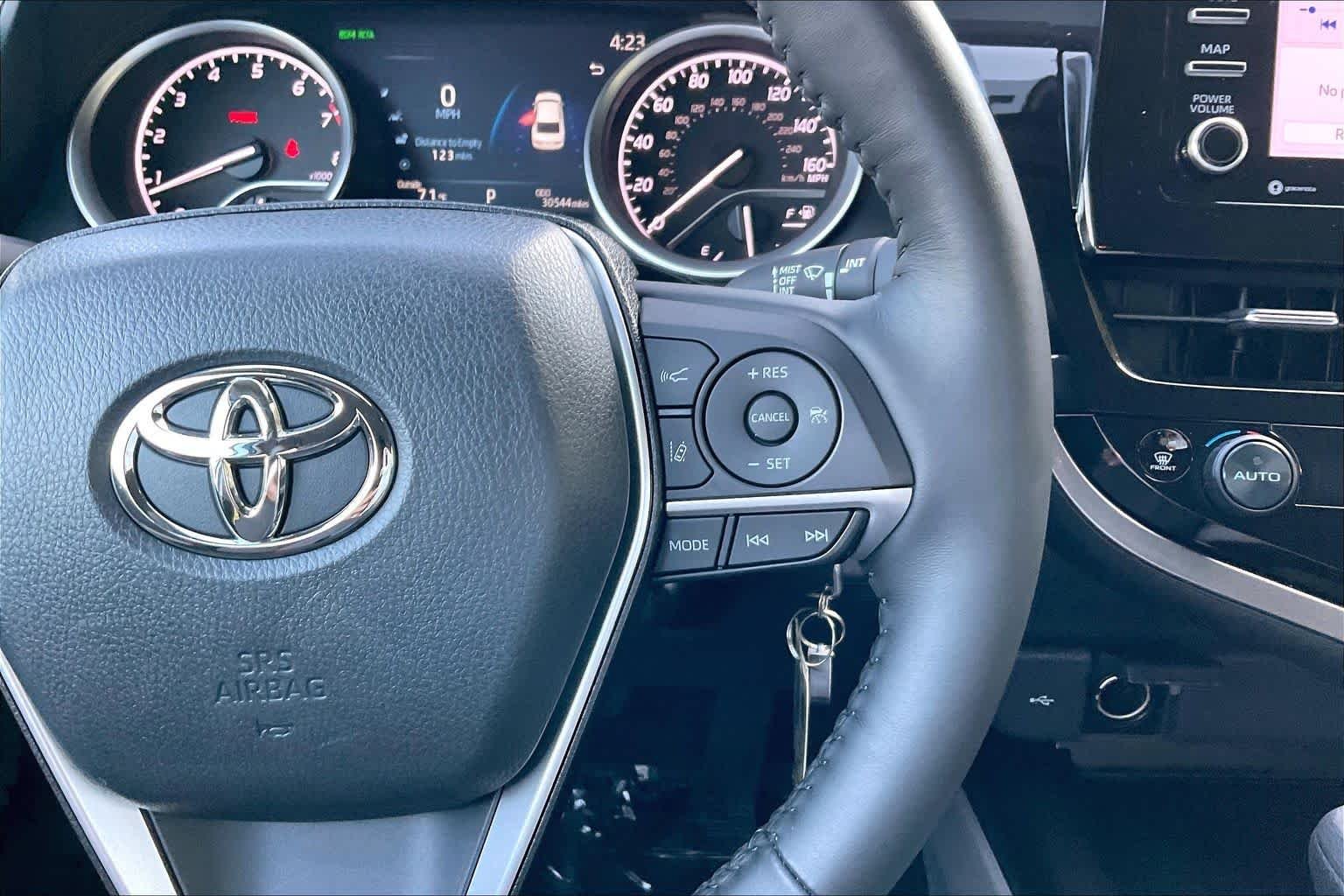 Used 2023 Celestial Silver Metallic Toyota LE image 23