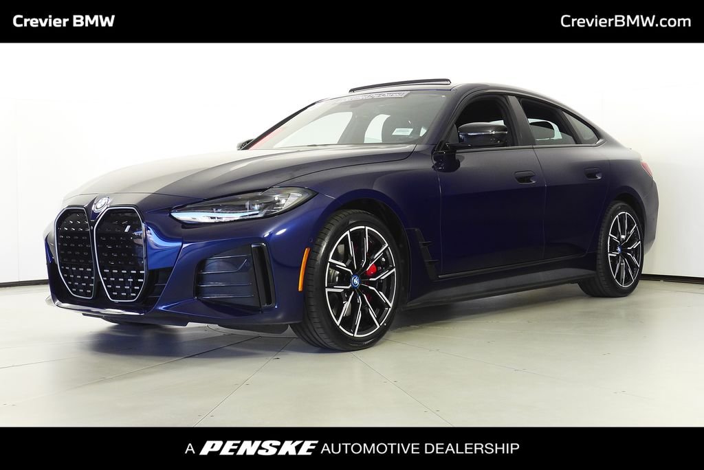 Certified Used 2023 Tanzanite Blue II Metallic BMW eDrive40 image 1