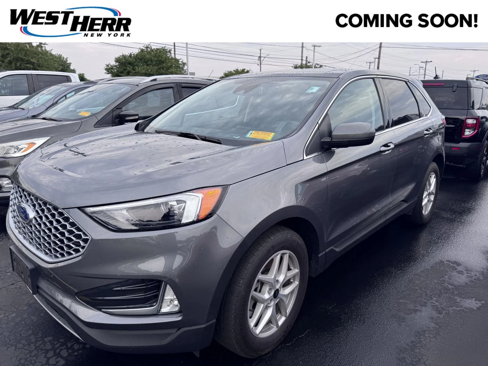 Used 2024 Carbonized Gray Ford SEL image 1