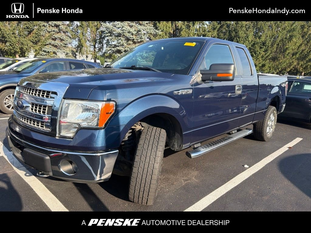Used 2013 Blue Ford XLT image 1