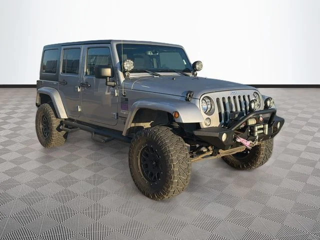 Used 2015 Silver Jeep Unlimited Sahara image 1