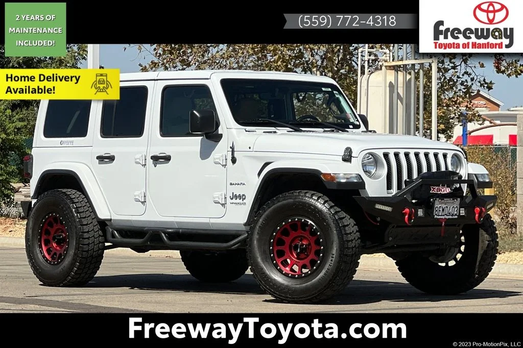 Used 2018 White Jeep Unlimited Sahara image 1