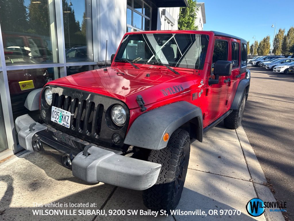 Used 2018 Red Jeep Unlimited Willys Wheeler image 1
