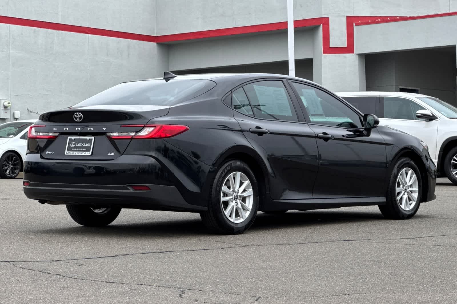 Used 2025 Midnight Black Metallic Toyota LE image 2