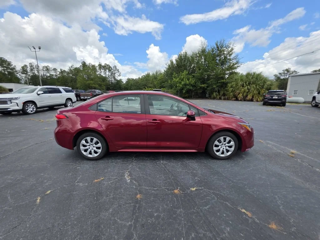 Used 2024 Red Med Toyota LE image 3