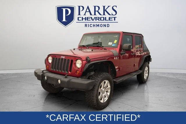 Used 2013 Red Jeep Unlimited Sahara image 3