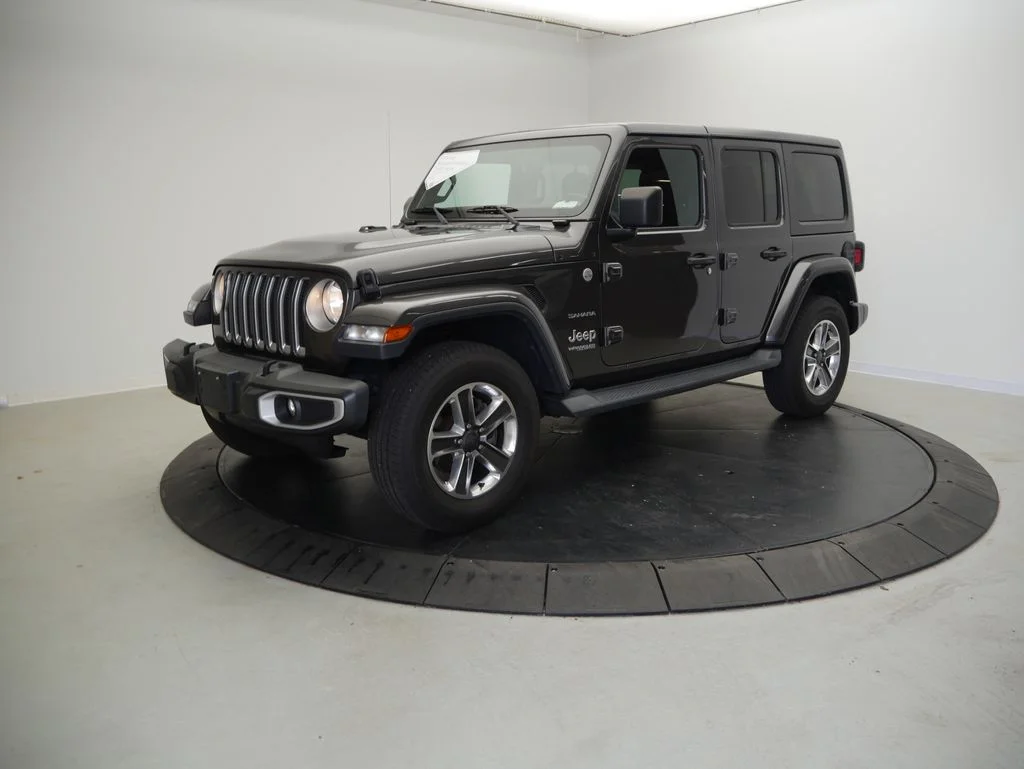Used 2018 Crystal Metallic Jeep Unlimited Sahara image 1