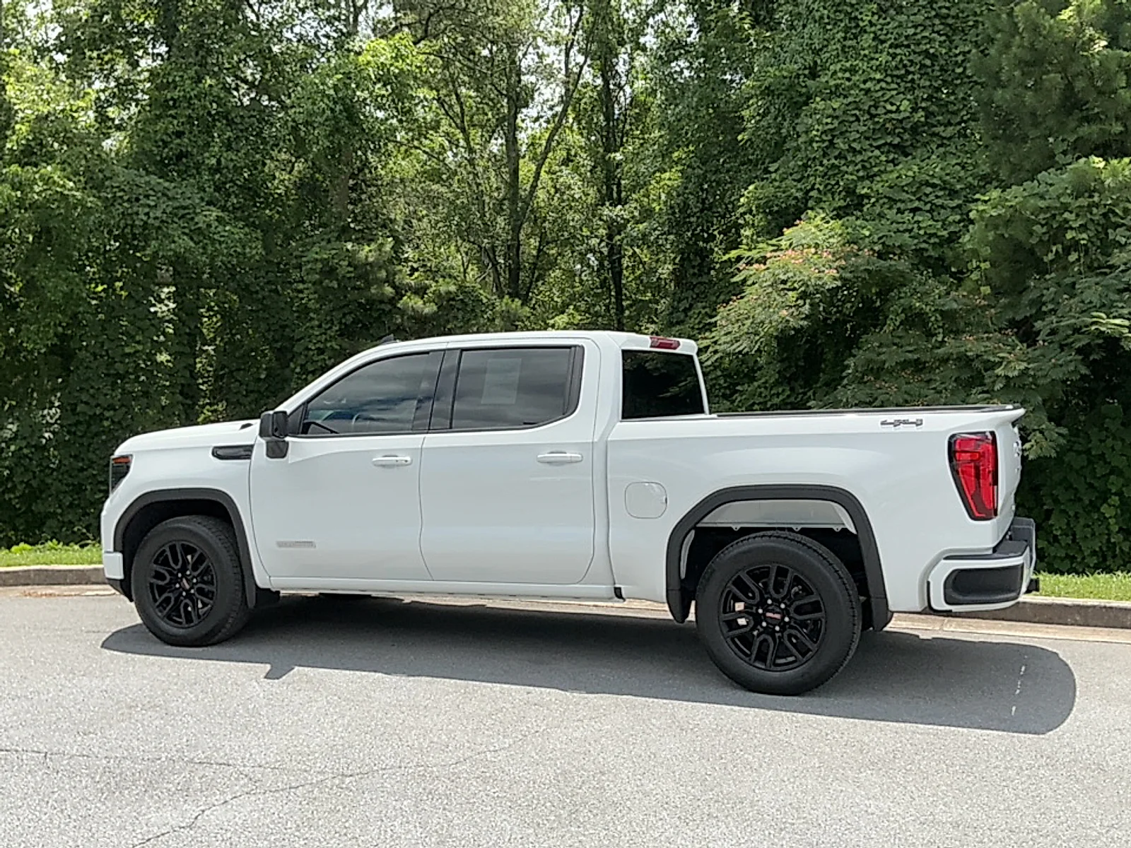 Used 2024 Summit White GMC 4WD Crew Cab Short Box Elevation with 3SB image 3