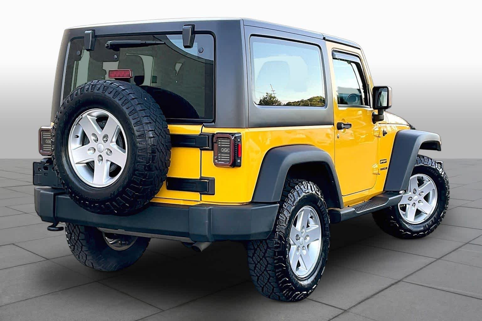 Used 2015 Baja Yellow Clearcoat Jeep Sport image 13