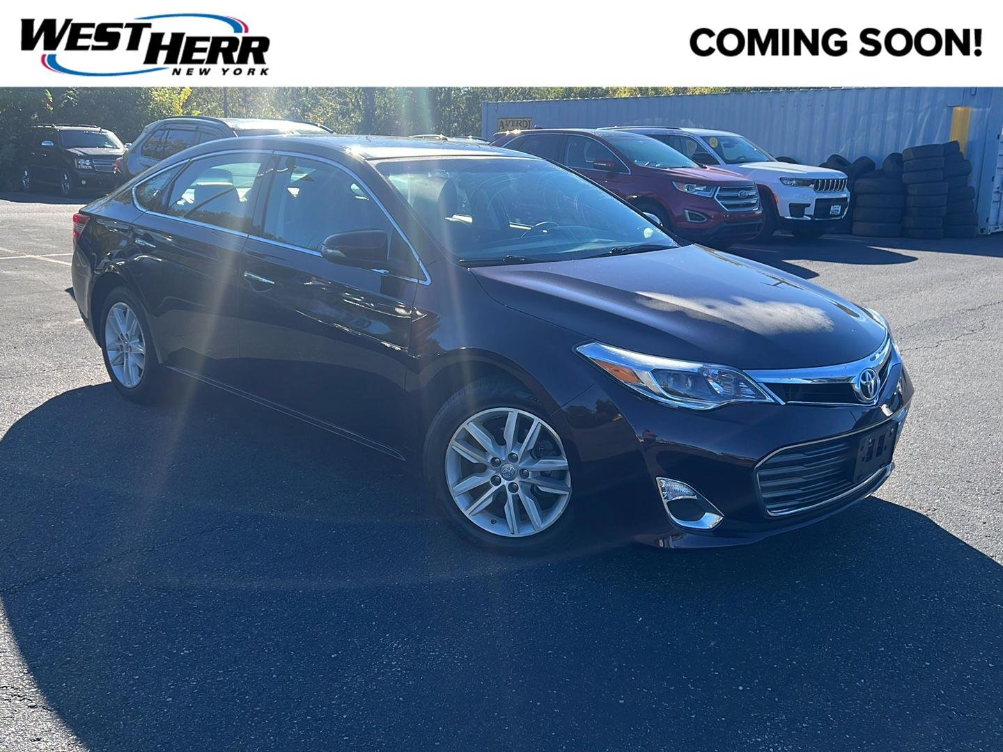 Used 2015 Sizzling Crimson Mica Toyota XLE image 1