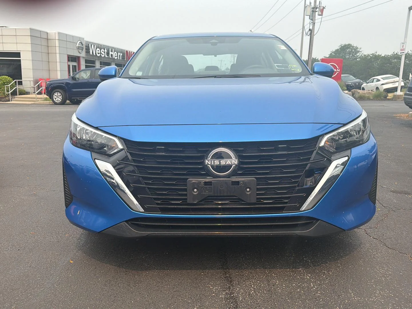 Used 2024 Electric Blue Metallic Nissan SV image 2