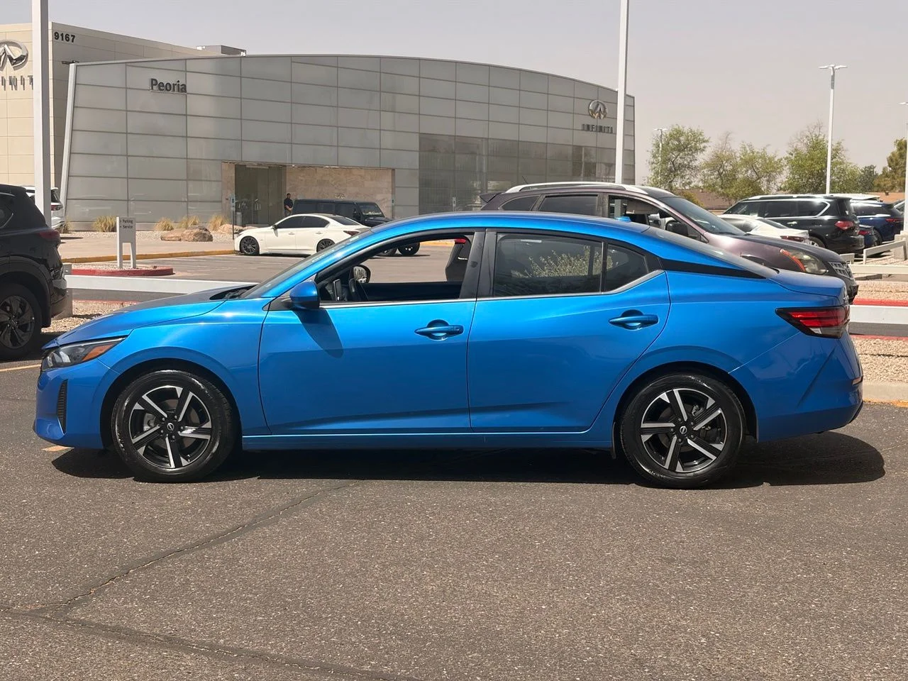 Used 2024 Electric Blue Metallic Nissan SV image 2