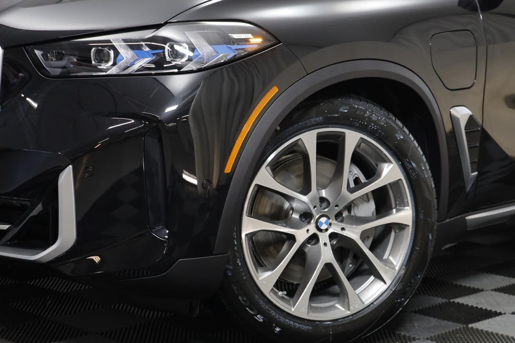 New 2026 Black Sapphire Metallic BMW xDrive50e image 4