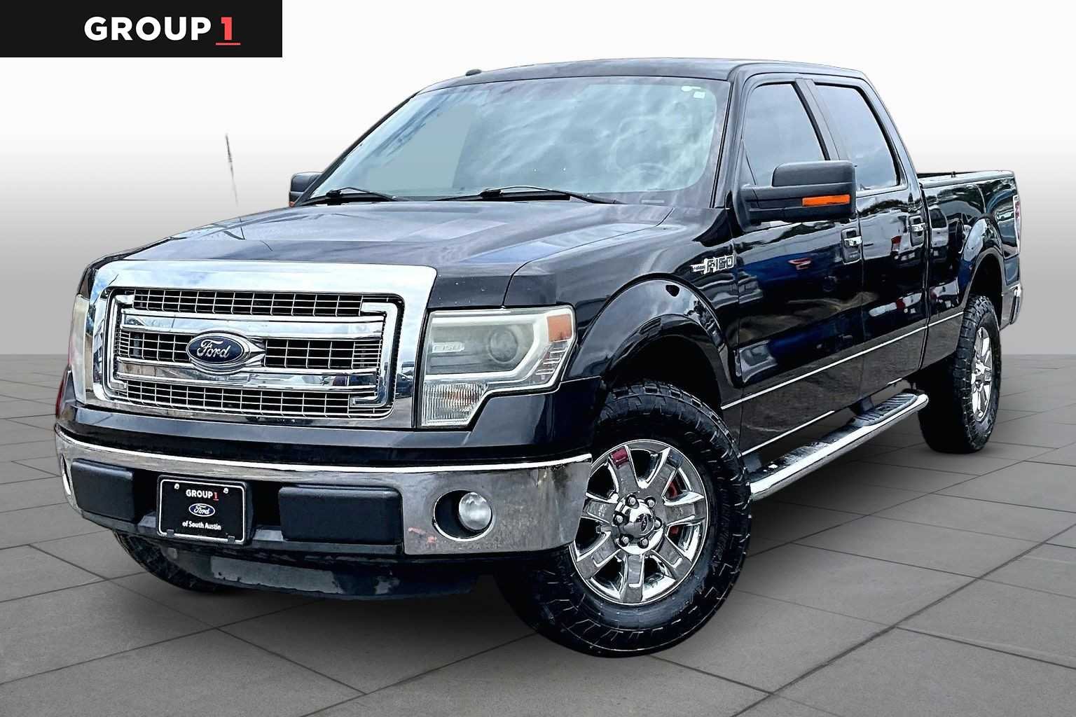 Used 2014 Tuxedo Black Metallic Ford XLT image 1