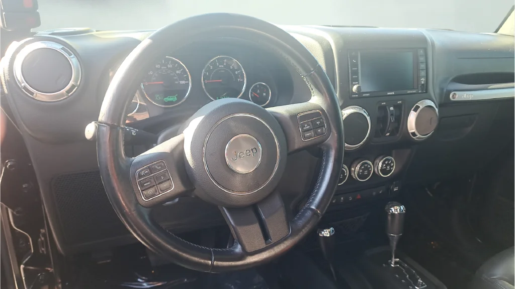 Used 2015 Black Jeep Unlimited Sahara image 17