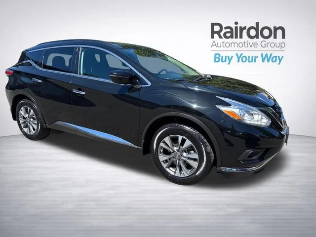 Used 2017 Magnetic Black Metallic Nissan SV image 1