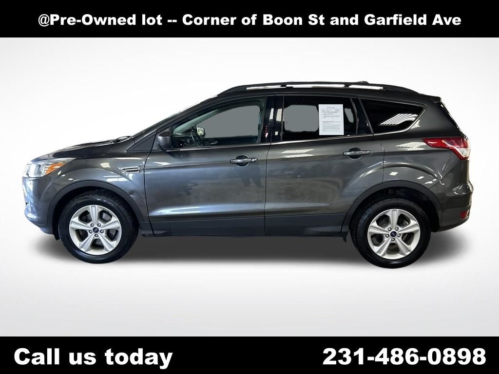 Used 2016 Ford Escape SE with VIN 1FMCU9GX7GUC64131 for sale in Traverse City, MI