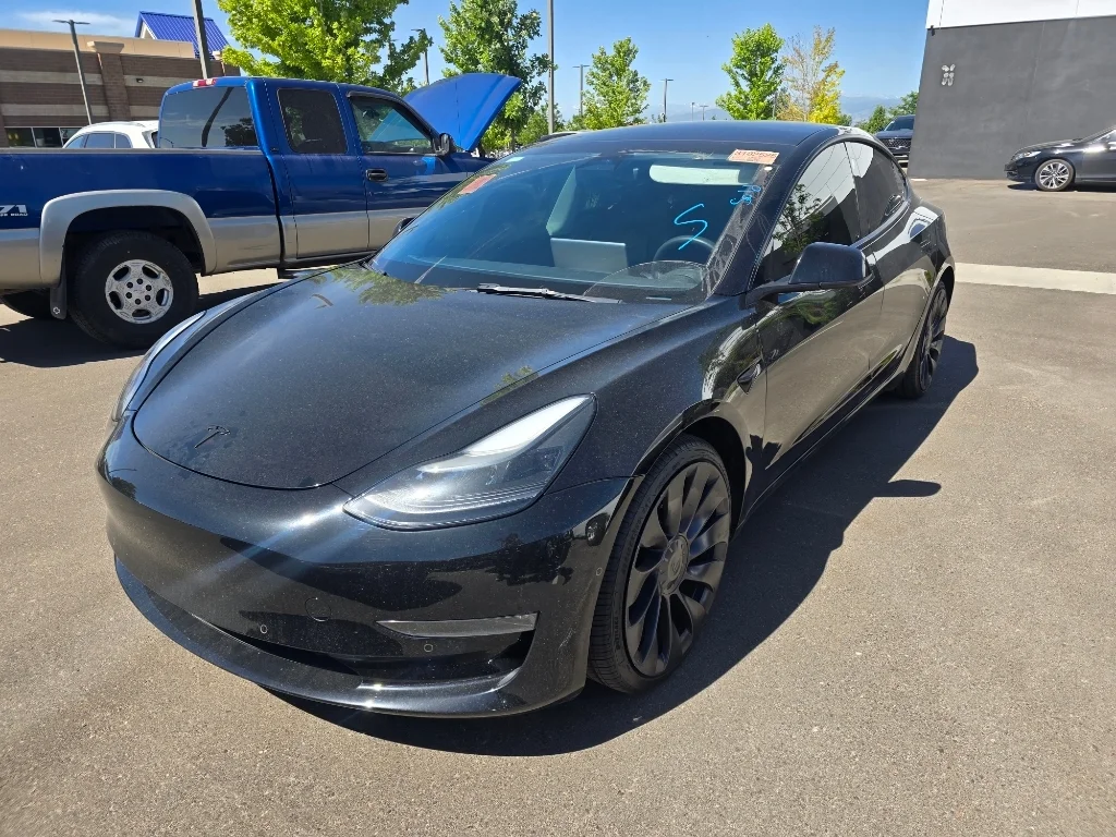 Used 2022 Solid Black Tesla Performance image 11