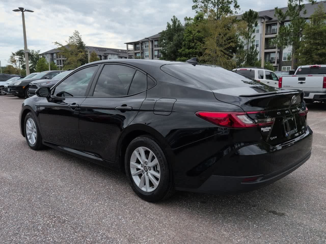 Used 2025 Midnight Black Metallic Toyota LE image 4
