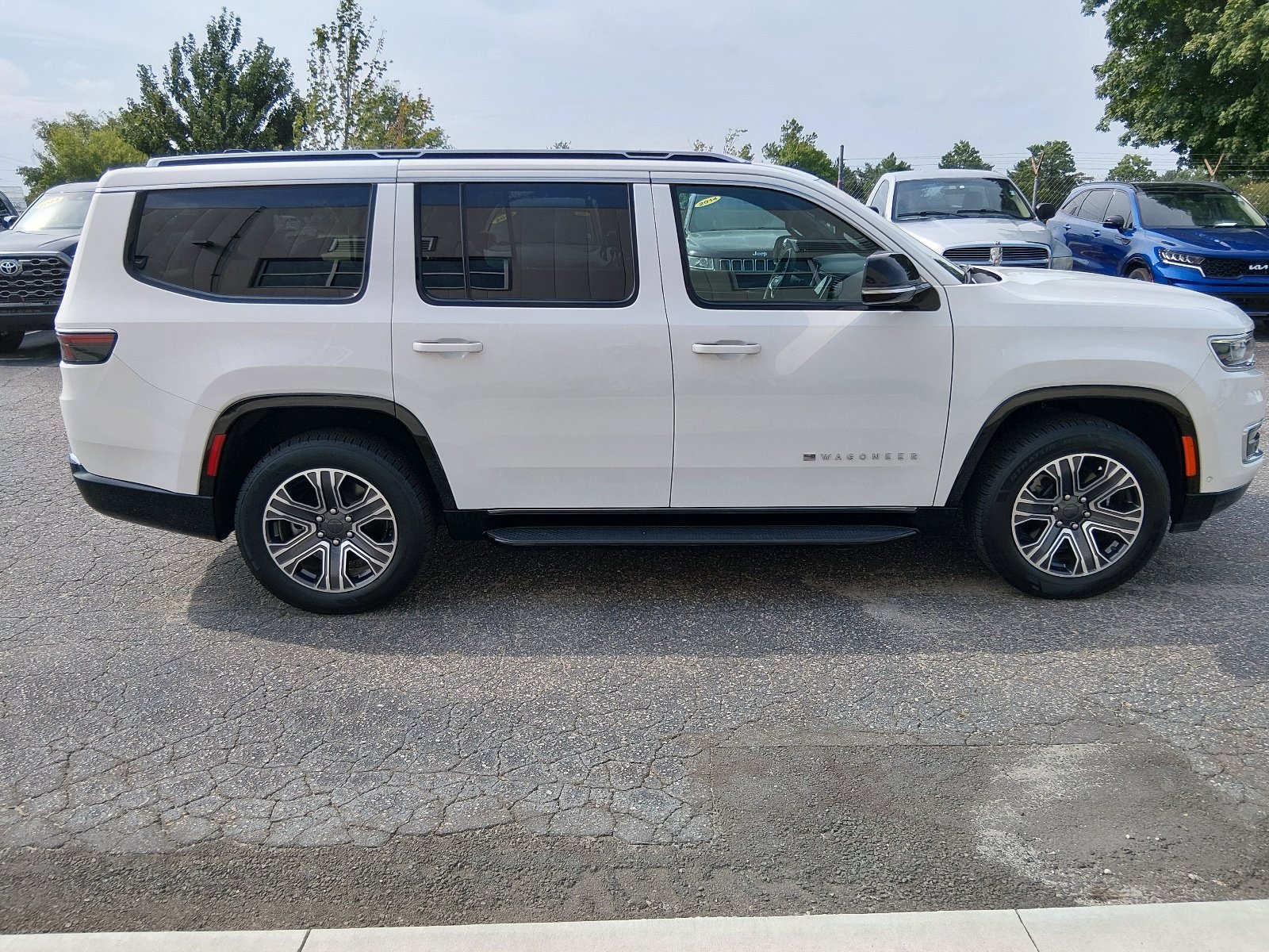 Used 2024 Bright White Clear Coat Jeep Series II image 2