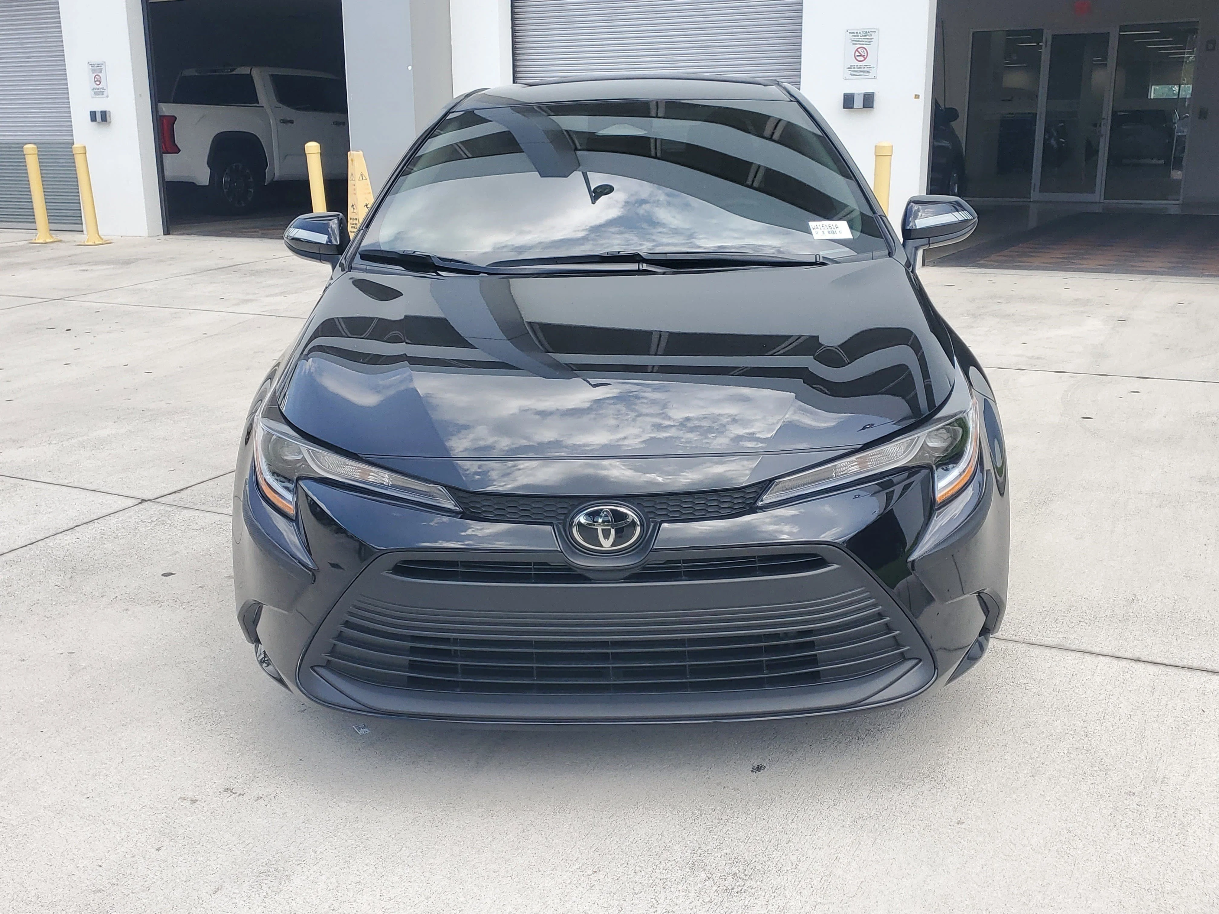 Used 2025 Midnight Black Metallic Toyota LE image 8