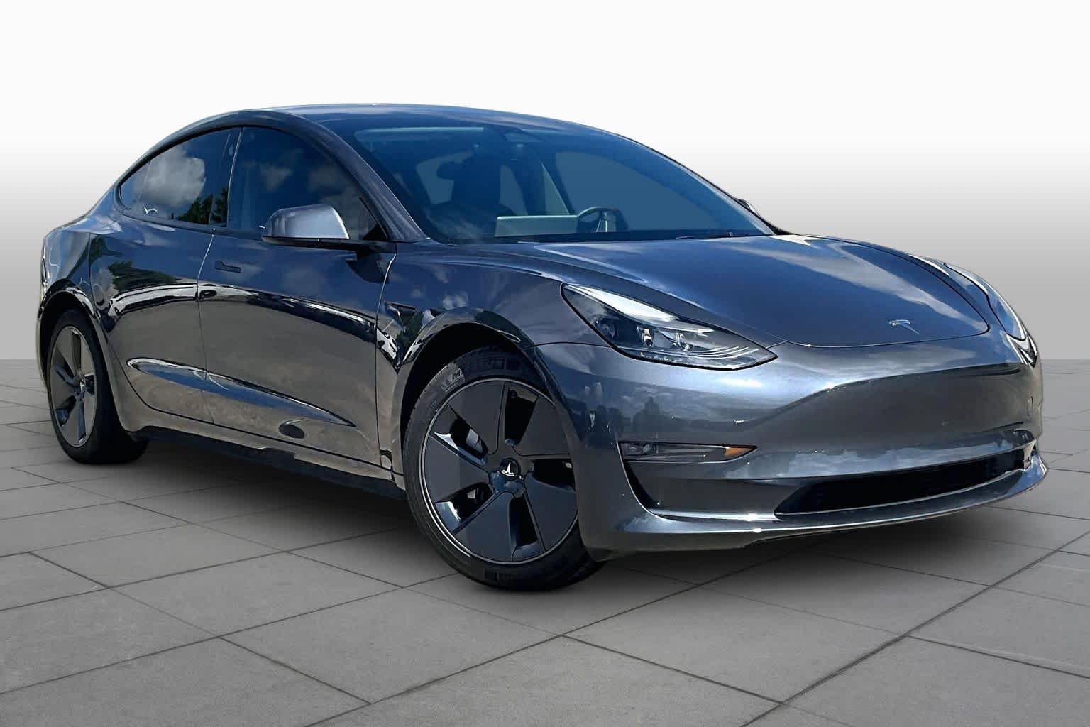 Used 2023 Solid Black Tesla  image 2