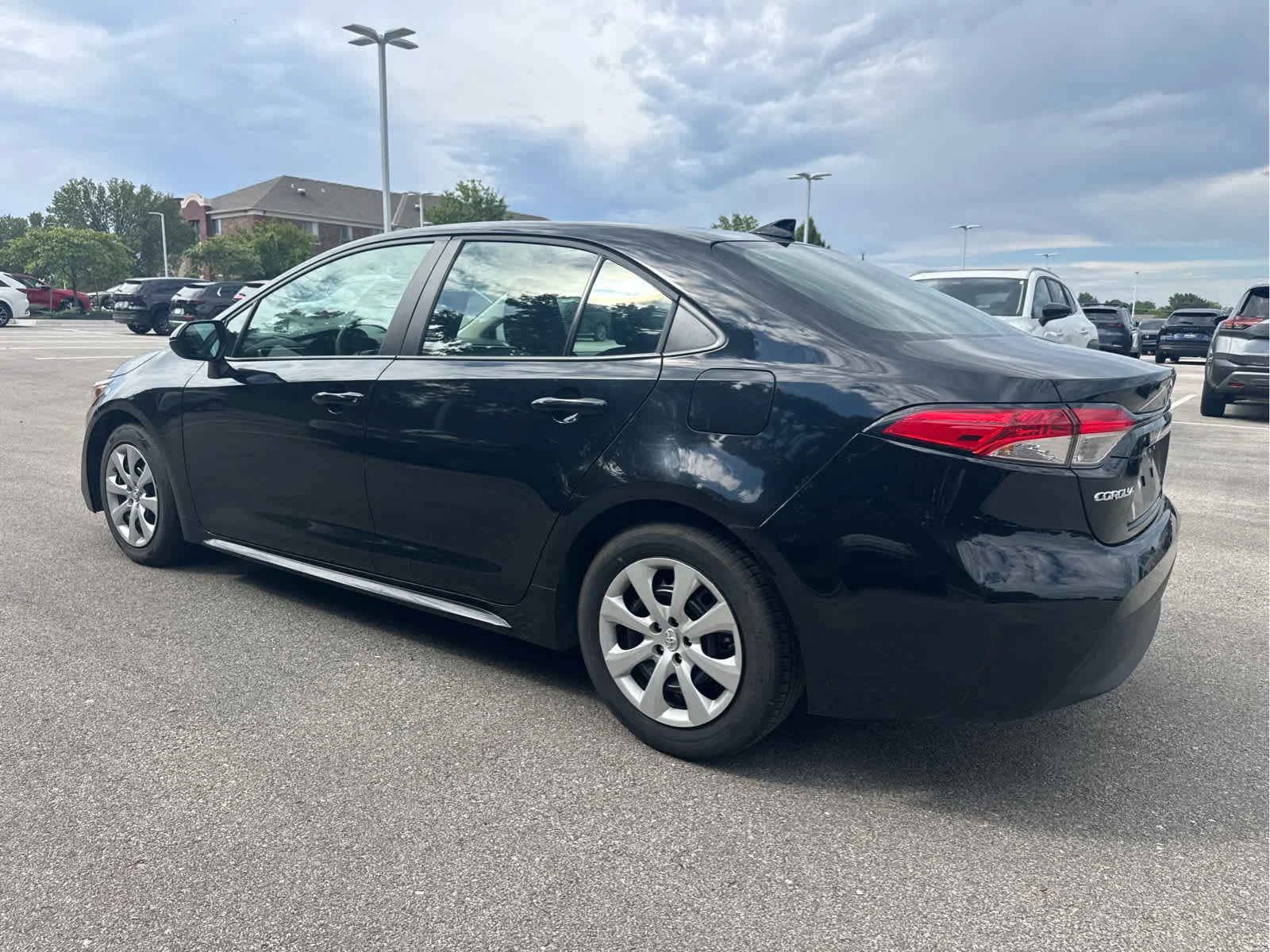 Used 2025 Midnight Black Metallic Toyota LE image 3
