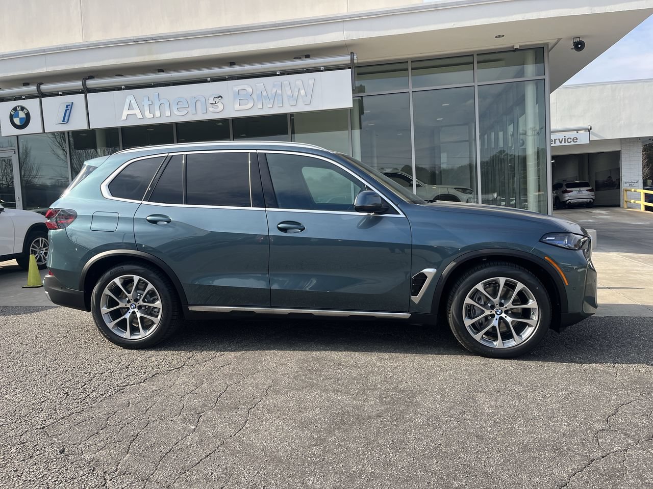 Used 2026 Blue Ridge Mountain Metallic BMW xDrive50e image 9