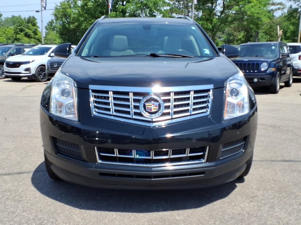 Used 2015 Cadillac SRX Luxury Collection with VIN 3GYFNBE32FS557854 for sale in Howell, MI