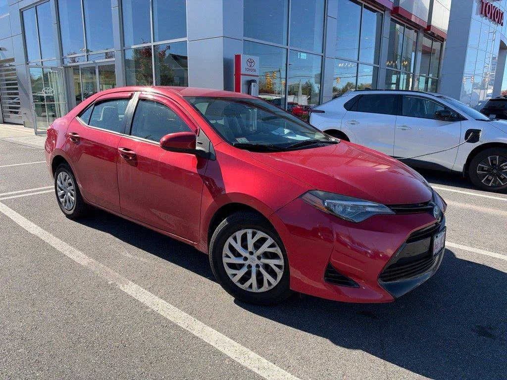 Used 2018 Barcelona Red Metallic Toyota LE image 1