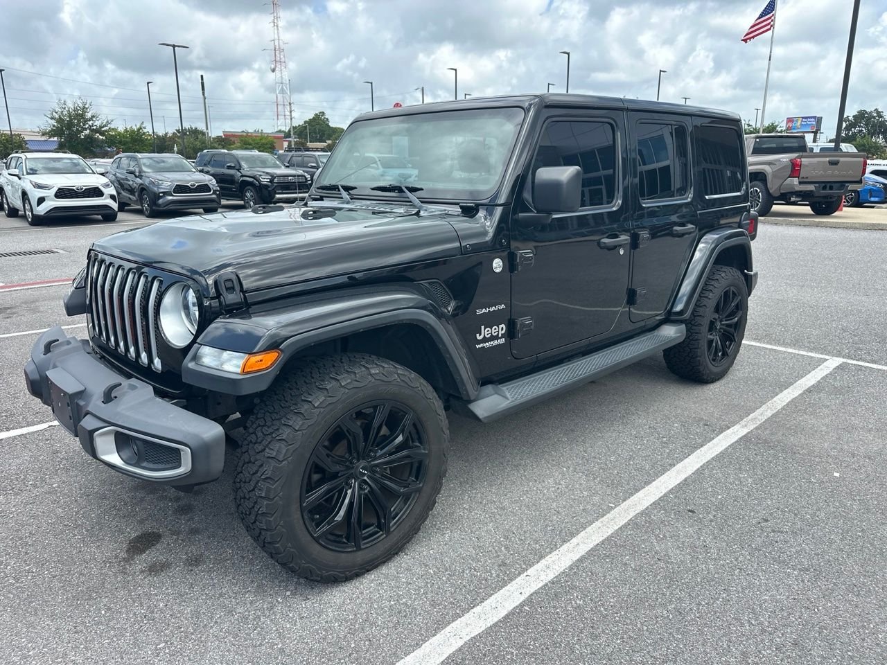 Used 2020 Black Jeep Unlimited Sahara image 1