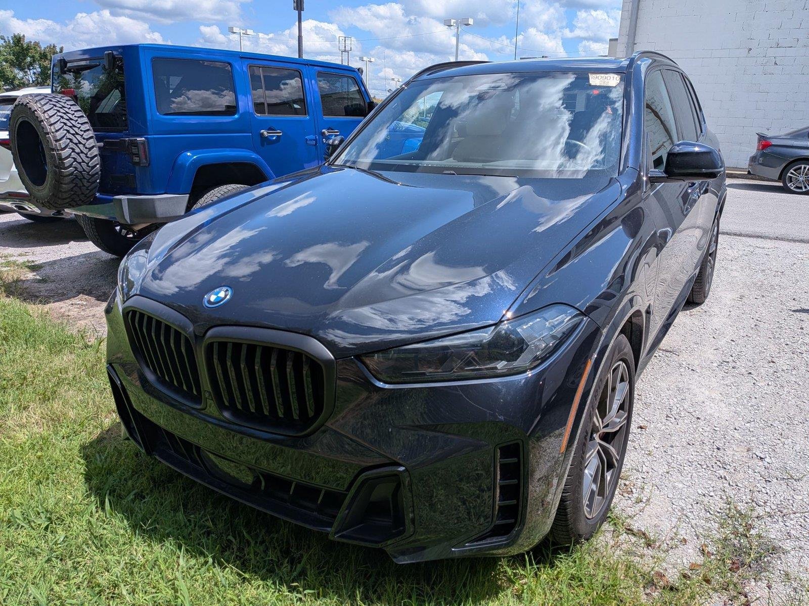 Used 2024 Carbon Black Metallic BMW xDrive50e image 2