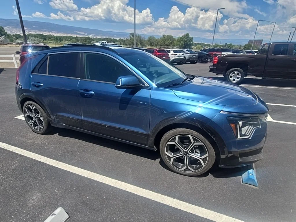 Used 2023 Mineral Blue Kia EX Touring image 1