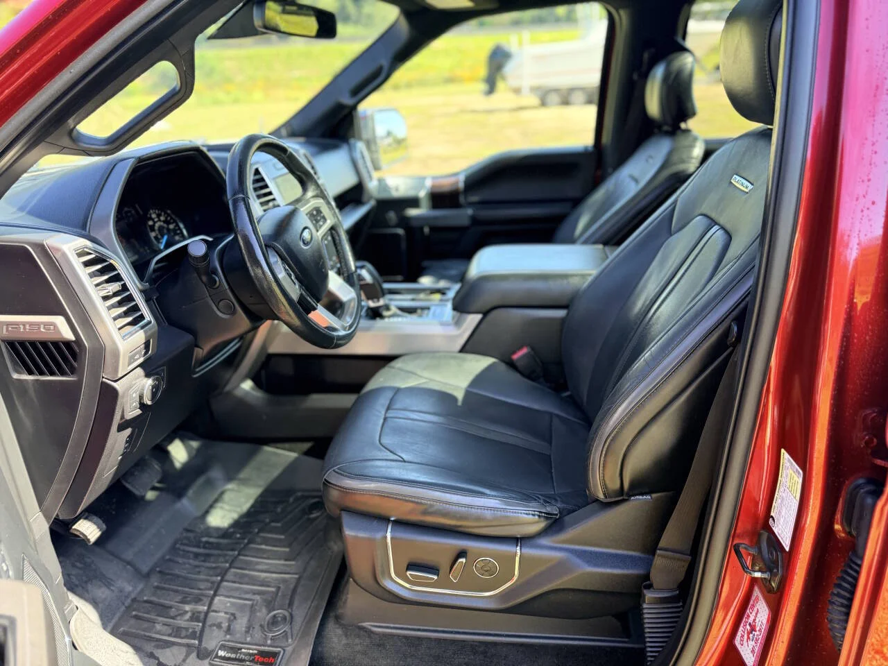 Used 2015 Red Ford Platinum 4x4 4dr SuperCrew 5.5 ft. SB image 16