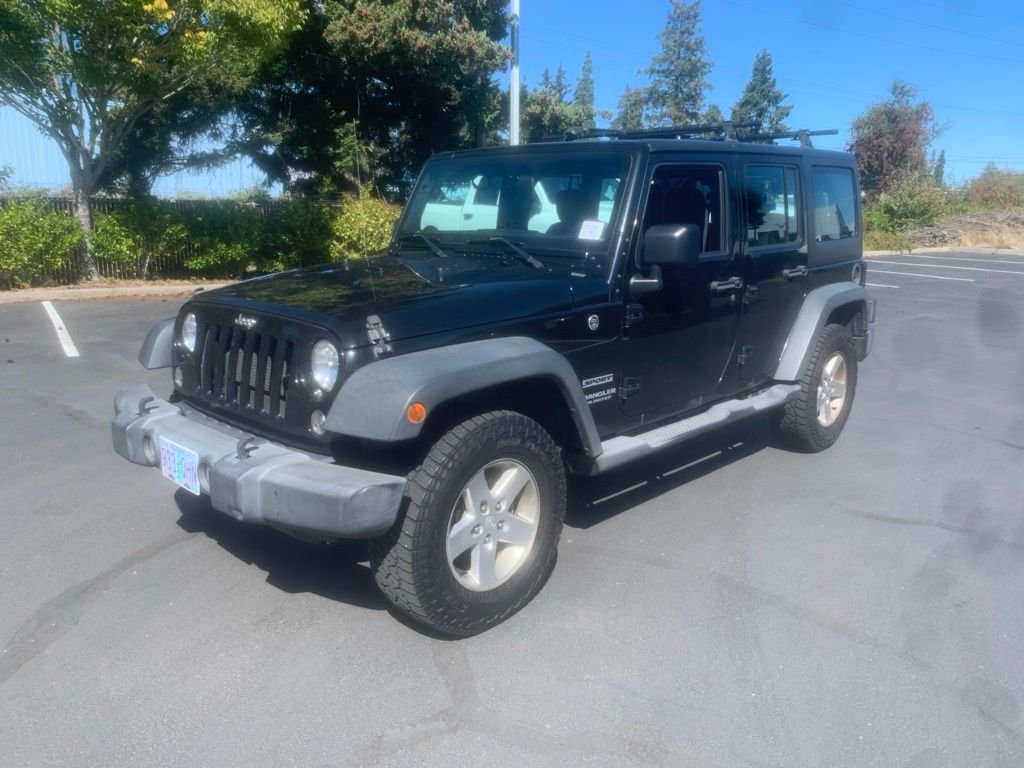 Used 2016 Black Clearcoat Jeep Unlimited Sport image 1