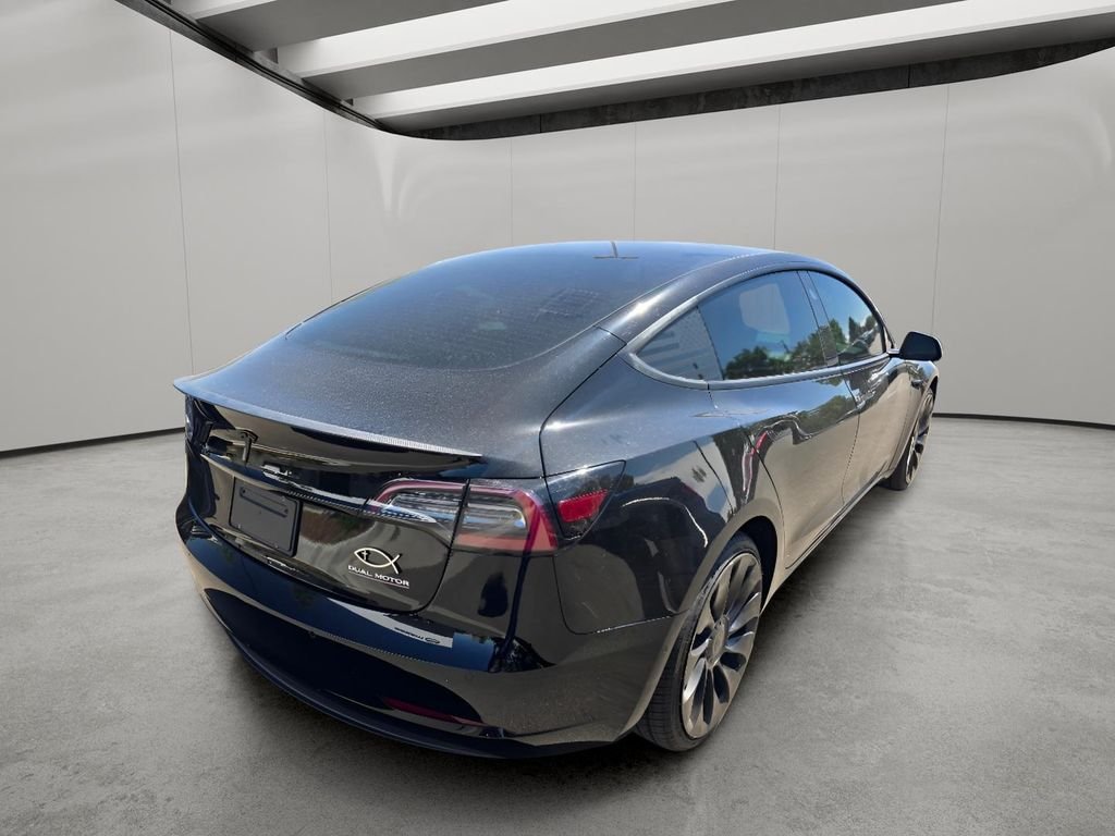 Used 2022 Solid Black Tesla Performance image 10