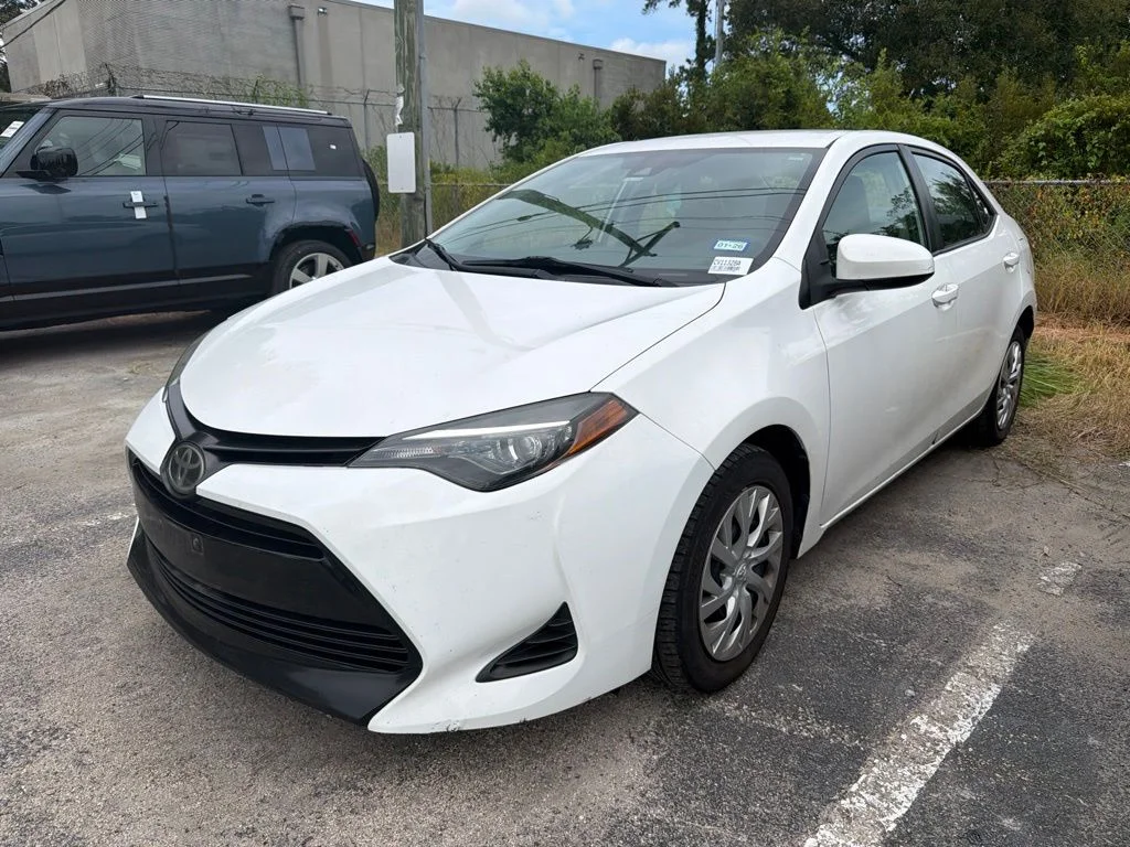 Used 2019 White Toyota LE image 1