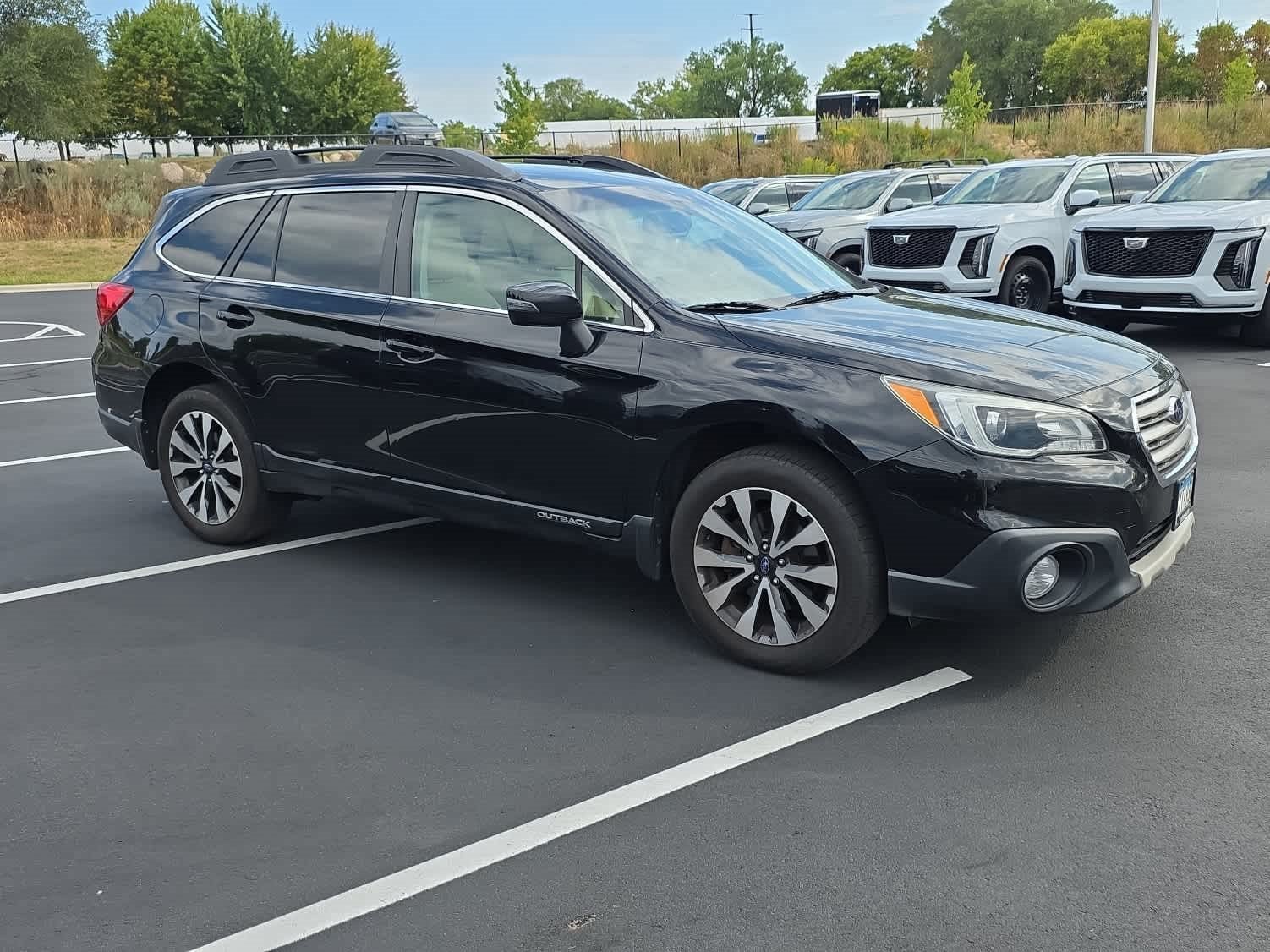 Used 2015 Subaru Outback Limited with VIN 4S4BSELC1F3222524 for sale in Vadnais Heights, MN