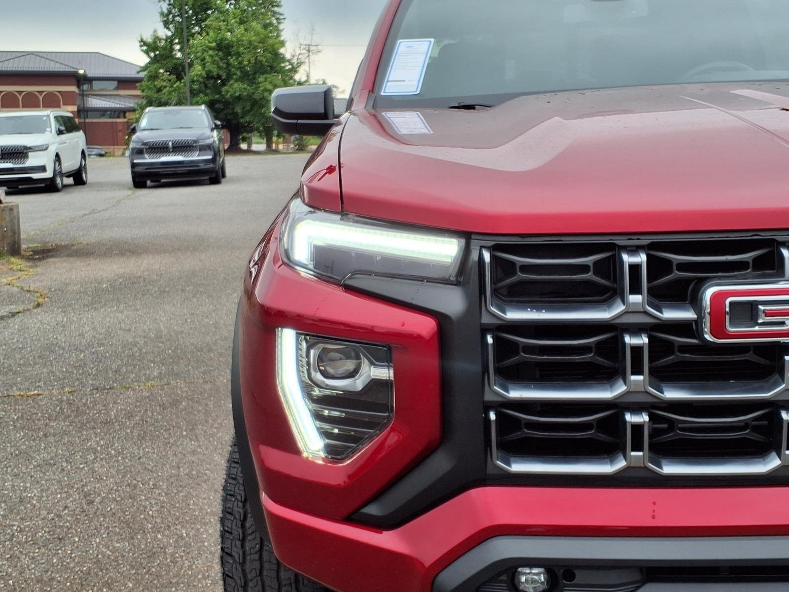 Used 2025 Volcanic Red Tintcoat GMC 4WD AT4 image 15