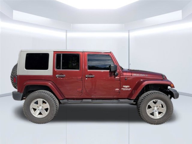 Used 2010 Red Jeep Unlimited Sahara image 5