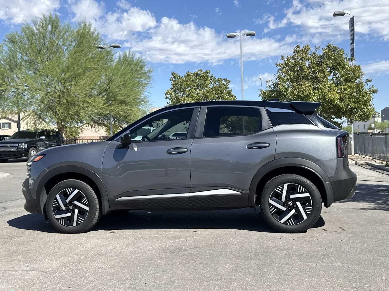 Used 2025 Gun Metallic/Super Black Nissan SV image 5