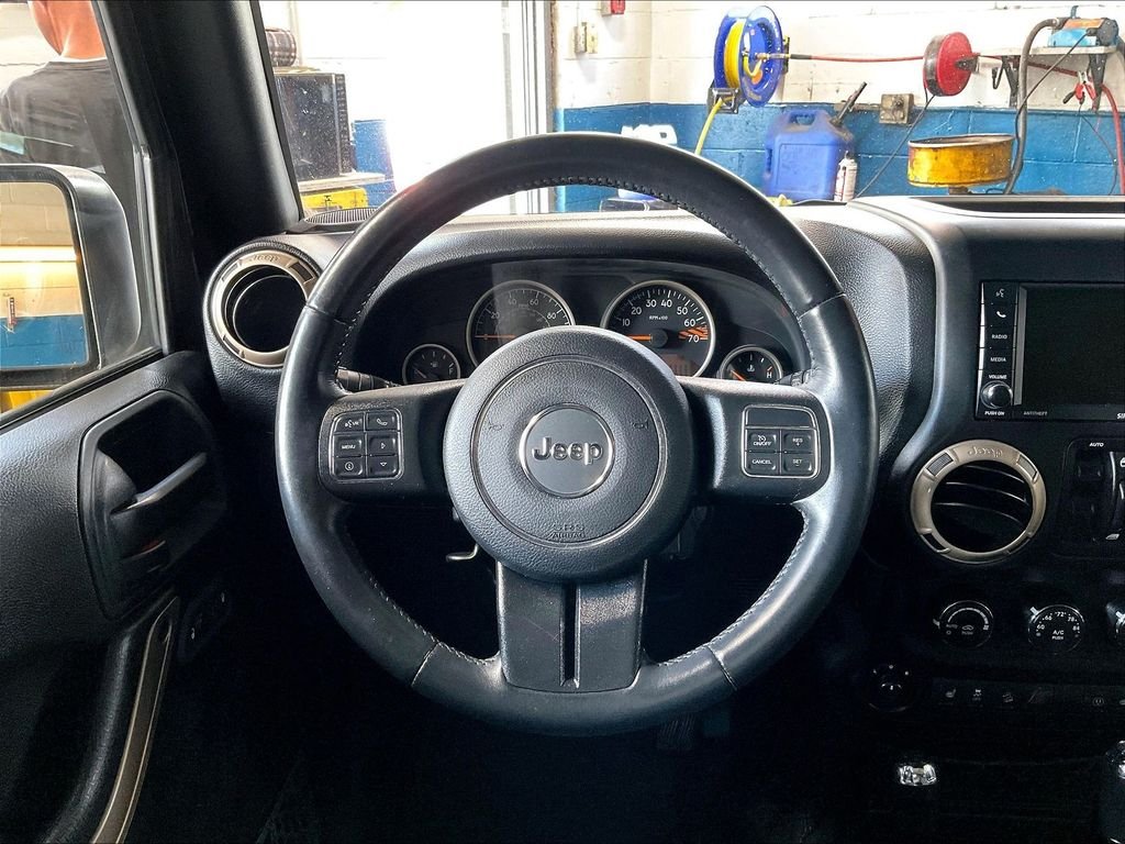 Used 2017 Black Jeep Unlimited Sahara image 16