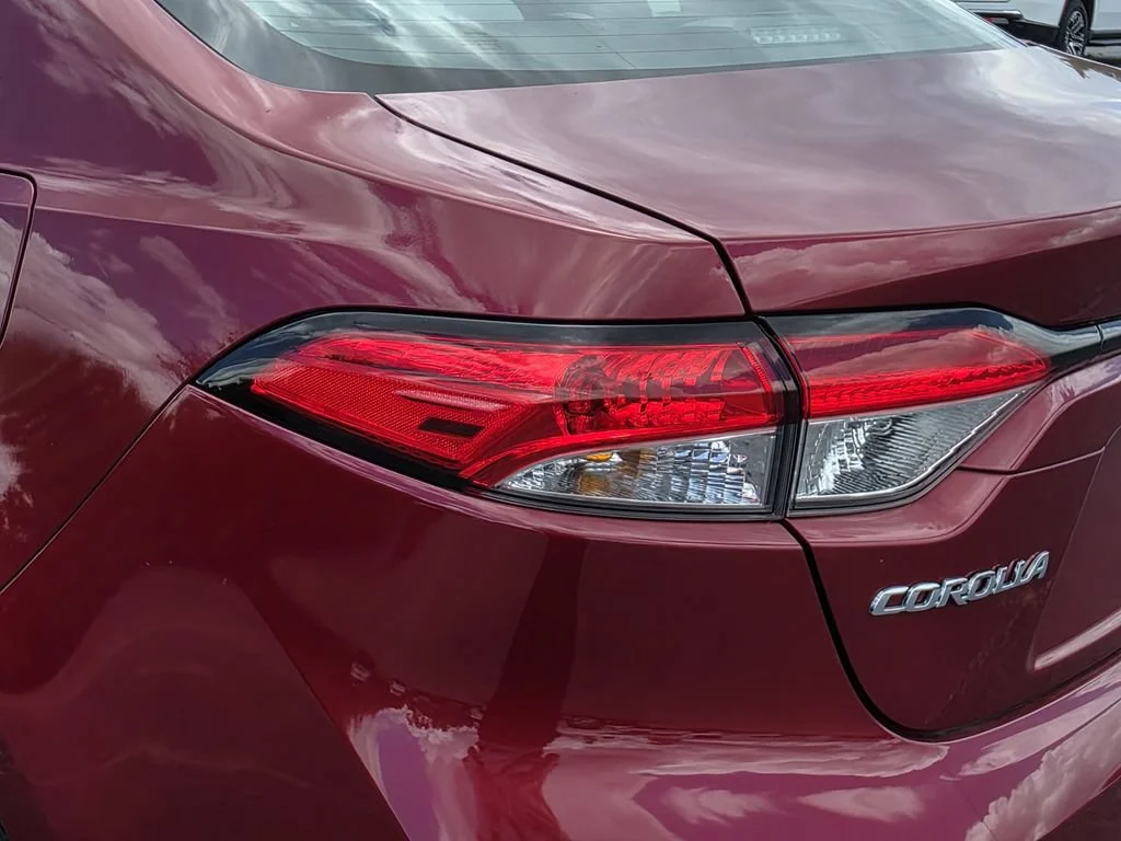 Used 2024 Red Med Toyota LE image 8