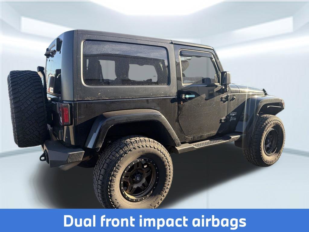 Used 2015 Black Clearcoat Jeep Sahara image 8